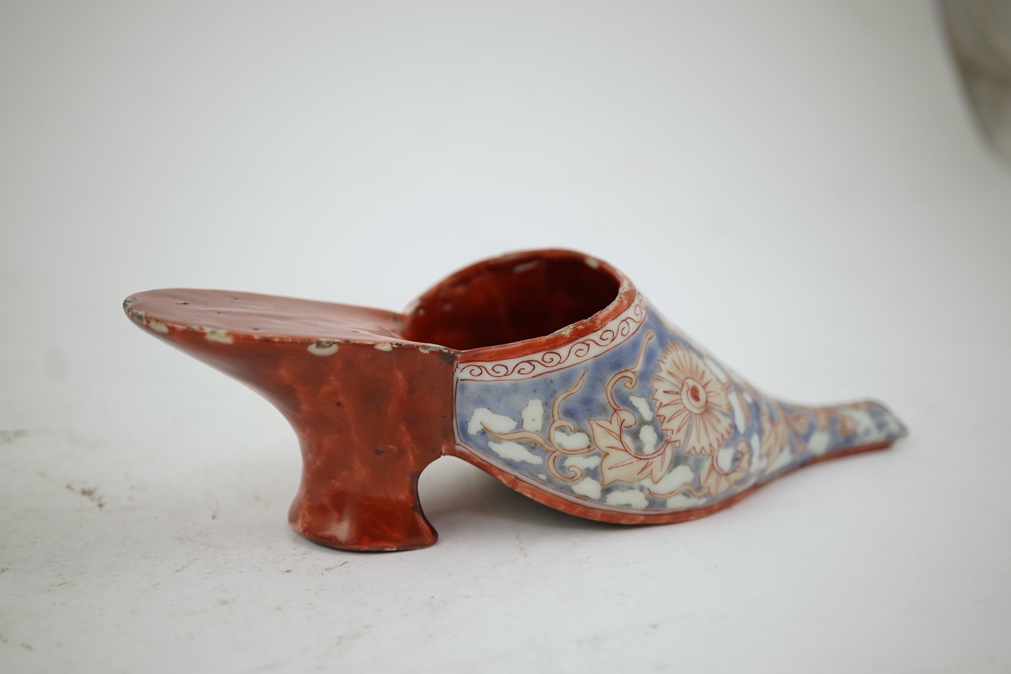 A rare Japanese Arita or Chinese porcelain model of a shoe, based on a Delft shape, first half of 18th century